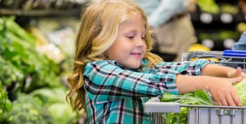 Child buying lettuce