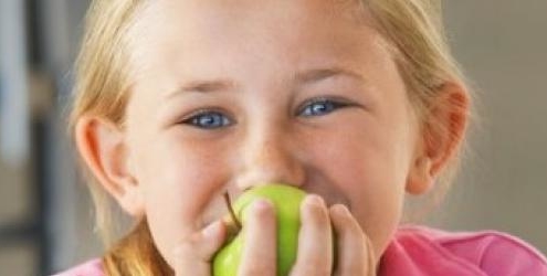 Girl eating an apple