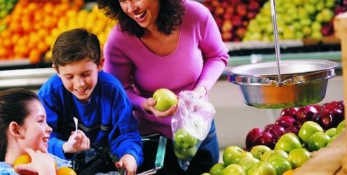 Mom with kids in supermarket
