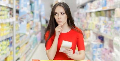 Woman grocery shopping aisle