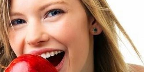 Woman eating an apple
